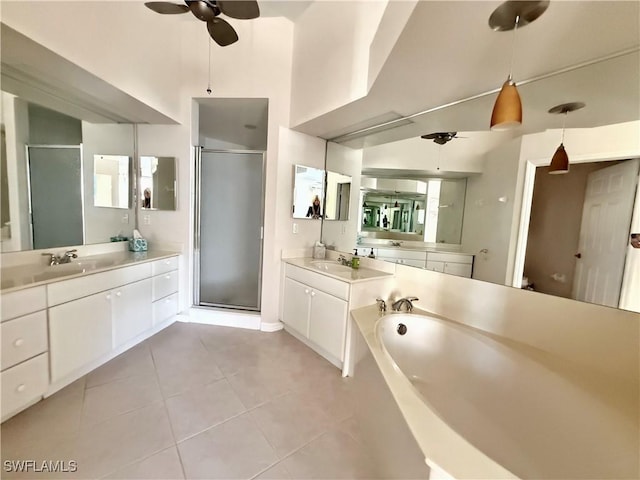 bathroom featuring ceiling fan, tile patterned floors, shower with separate bathtub, and vanity