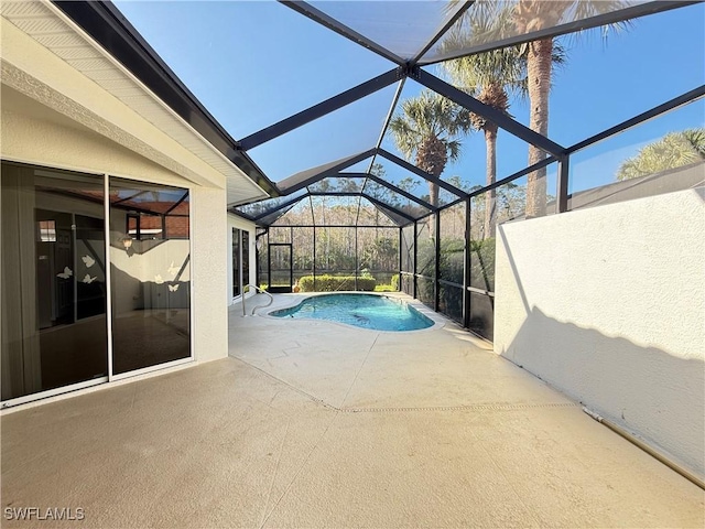 view of pool with a lanai and a patio