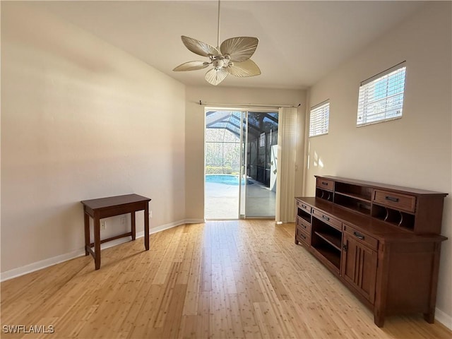 living room with ceiling fan and light wood-type flooring