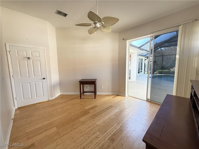 interior space with light hardwood / wood-style floors and ceiling fan