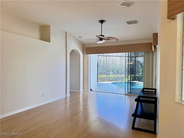 spare room featuring light hardwood / wood-style floors and ceiling fan