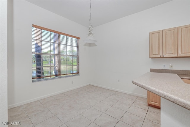 unfurnished dining area with light tile patterned floors