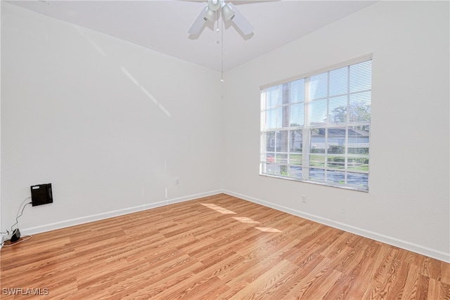 spare room featuring ceiling fan and light wood-type flooring