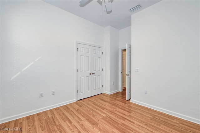 unfurnished room with ceiling fan and light hardwood / wood-style flooring