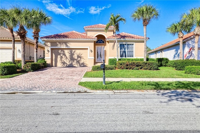 mediterranean / spanish-style home featuring a garage