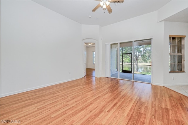 spare room with ceiling fan and light hardwood / wood-style floors