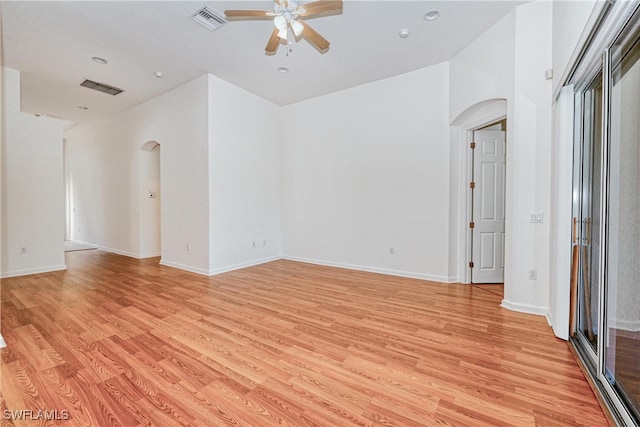 spare room featuring ceiling fan and light hardwood / wood-style floors