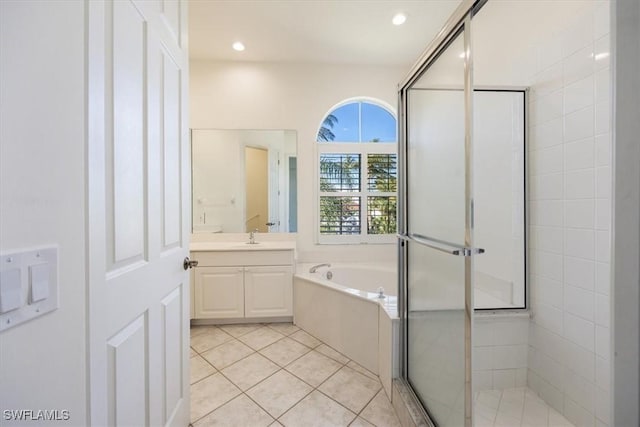 1575 Clermont Dr Unit N-201, Naples, FL 34109 - full bathroom featuring vanity, a garden tub, a stall shower, tile patterned flooring, and recessed lighting