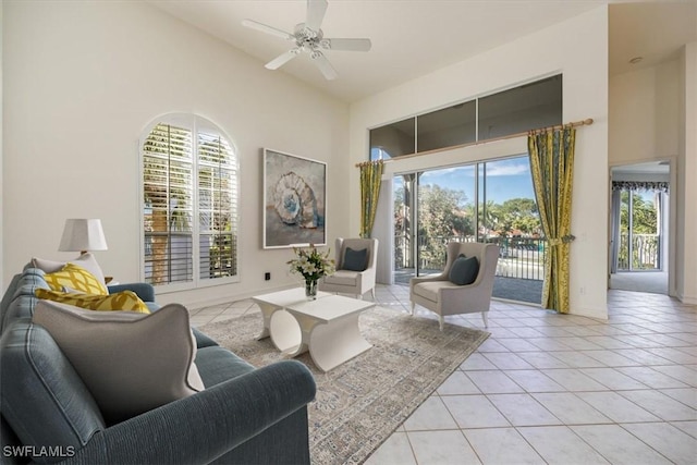 1575 Clermont Dr Unit N-201, Naples, FL 34109 - living room with high vaulted ceiling, ceiling fan, and light tile patterned flooring