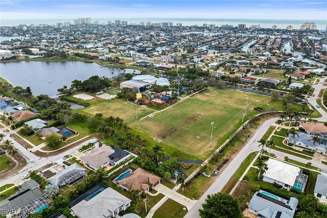 birds eye view of property featuring a water view