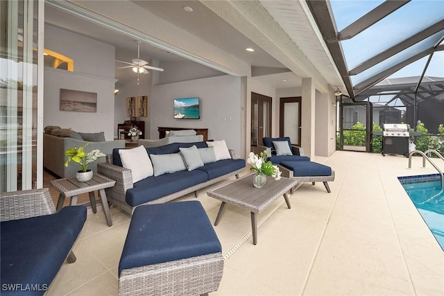 view of patio featuring an outdoor living space, glass enclosure, grilling area, and ceiling fan