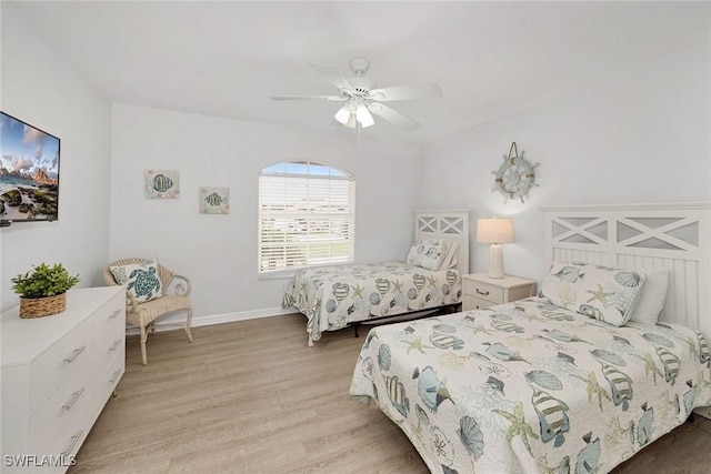 bedroom with light wood-type flooring and ceiling fan