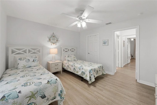 bedroom featuring ceiling fan and light hardwood / wood-style flooring