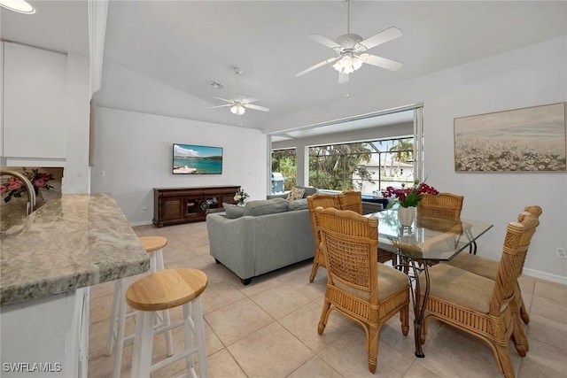 dining area featuring light tile patterned floors, ceiling fan, and lofted ceiling