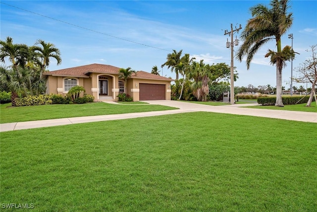 mediterranean / spanish house featuring a front yard and a garage