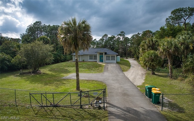 view of home's community featuring a lawn