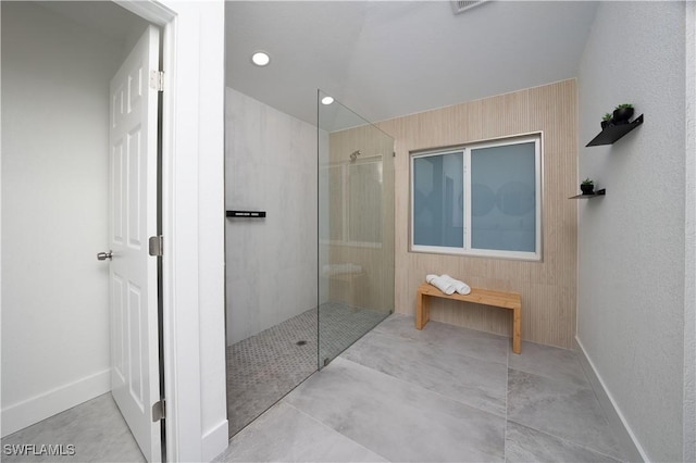 bathroom with tiled shower