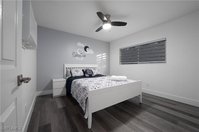 bedroom with dark hardwood / wood-style floors and ceiling fan