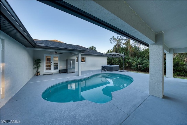 view of swimming pool with central AC unit, a hot tub, a patio, and ceiling fan