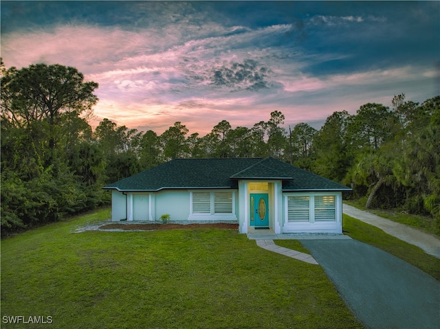 view of front of home with a lawn