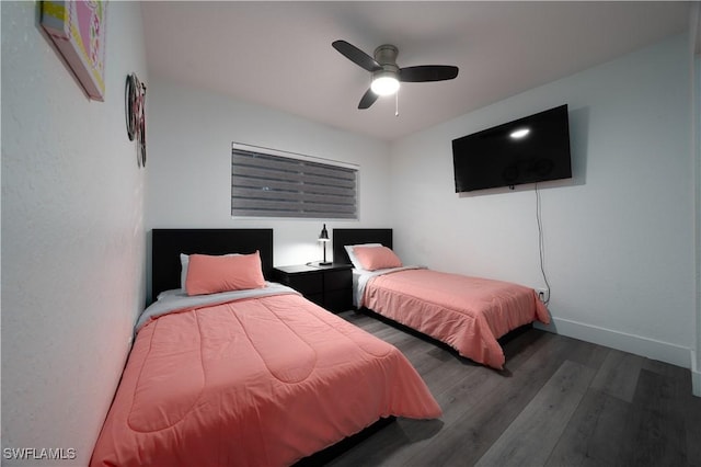 bedroom featuring dark wood-type flooring and ceiling fan