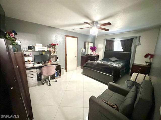 tiled bedroom featuring ceiling fan