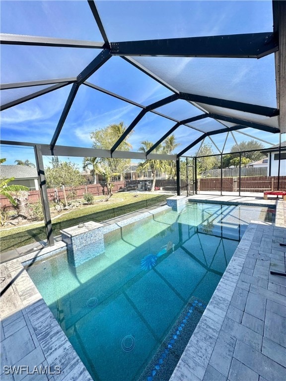 view of pool featuring a lanai and a patio