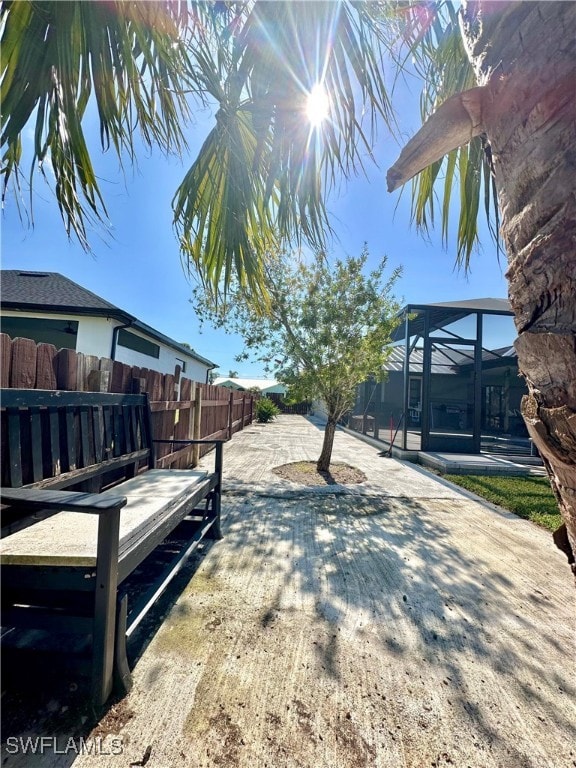 view of yard featuring a lanai