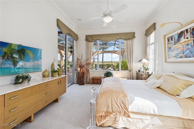 bedroom featuring ornamental molding, light carpet, access to exterior, and ceiling fan