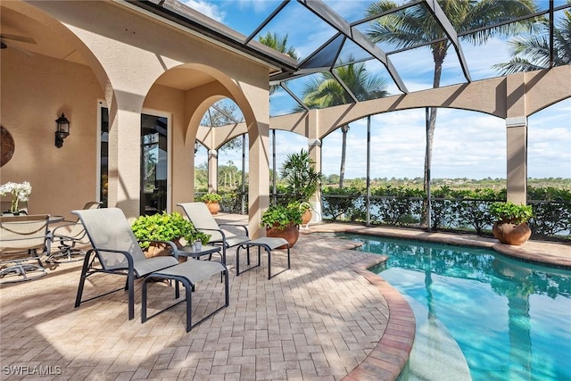 view of pool with a lanai and a patio area