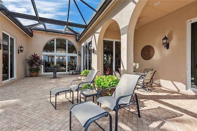 view of patio / terrace with glass enclosure