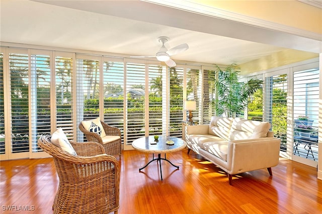 sunroom with ceiling fan and plenty of natural light