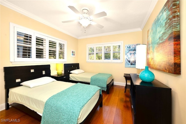 bedroom featuring ornamental molding, dark hardwood / wood-style floors, and ceiling fan