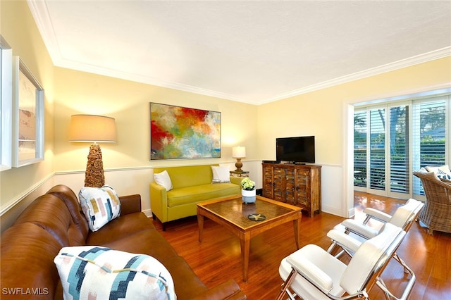 living room featuring hardwood / wood-style flooring and crown molding