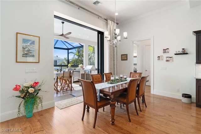 dining space featuring light hardwood / wood-style flooring, ornamental molding, and ceiling fan