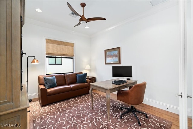 home office featuring crown molding, ceiling fan, and hardwood / wood-style flooring