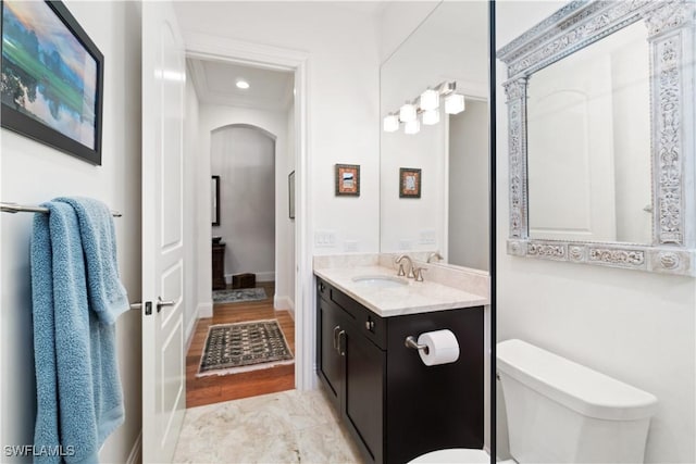 bathroom with vanity and toilet