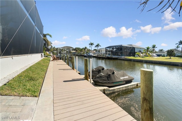 dock area with a water view and glass enclosure