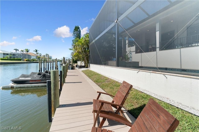 dock area with a water view and glass enclosure