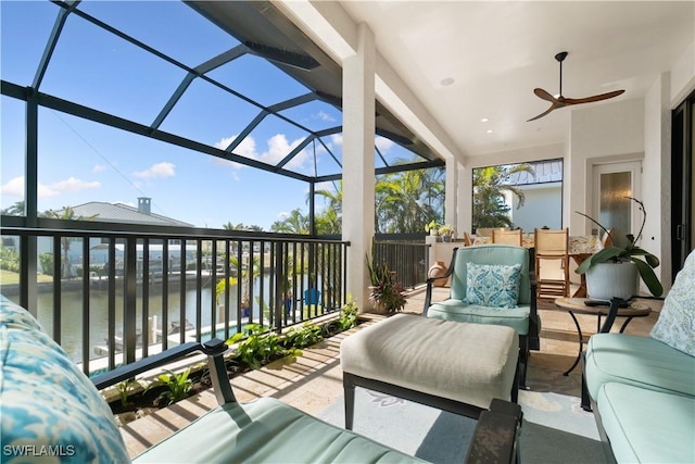 sunroom / solarium with a water view