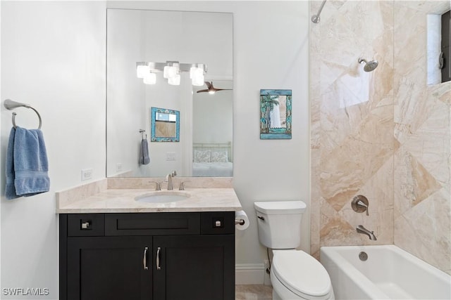 full bathroom with vanity, ceiling fan, toilet, and tiled shower / bath