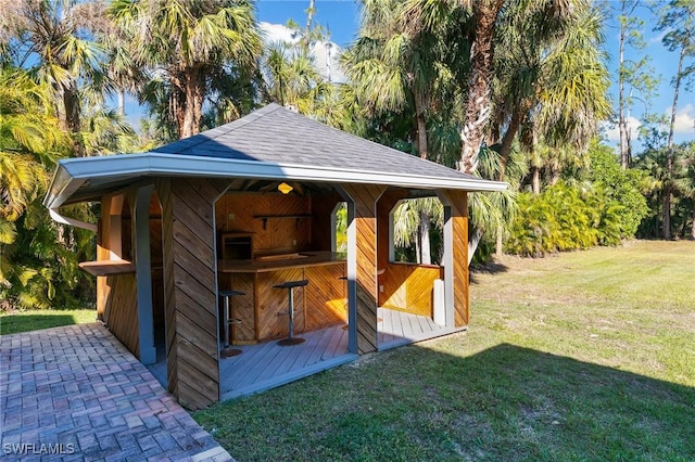 view of outbuilding with a lawn