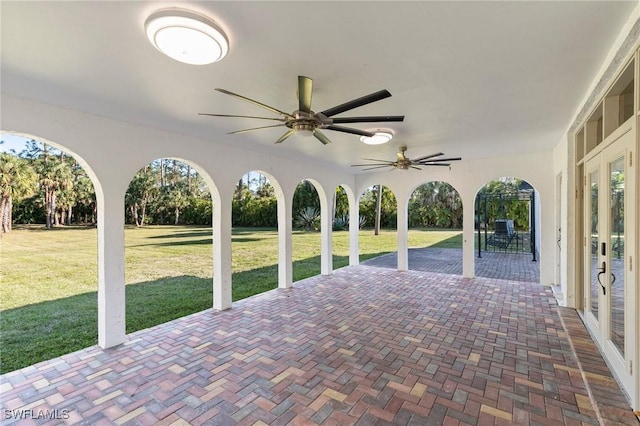 exterior space featuring ceiling fan