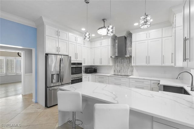 kitchen with white cabinets, wall chimney range hood, sink, and black appliances