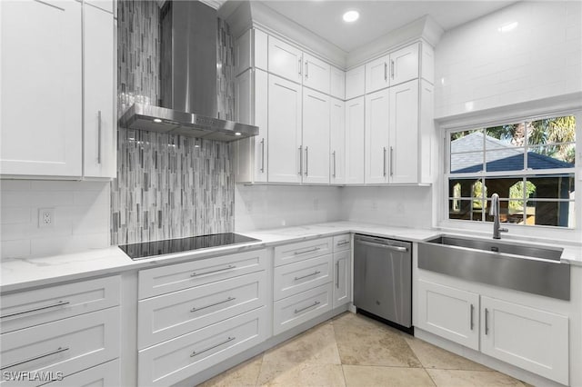 kitchen with sink, stainless steel dishwasher, white cabinets, and wall chimney exhaust hood