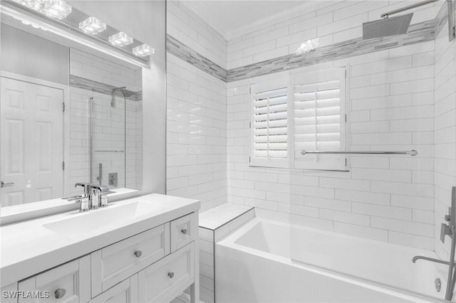 bathroom with vanity and tiled shower / bath