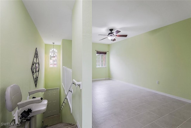 interior space with ceiling fan and a healthy amount of sunlight