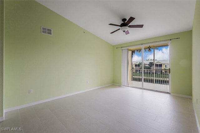 unfurnished room featuring a ceiling fan, lofted ceiling, and baseboards