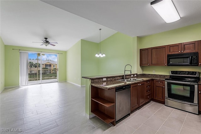 kitchen featuring sink, hanging light fixtures, stainless steel appliances, kitchen peninsula, and dark stone counters