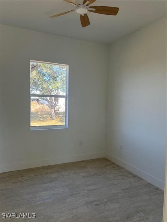 spare room featuring ceiling fan and light hardwood / wood-style floors